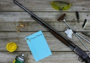 Rifle with cleaning tools and safety goggles